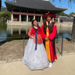 Tourists wearing hanbok at Gyeongbokgung Palace in Seoul, South Korea